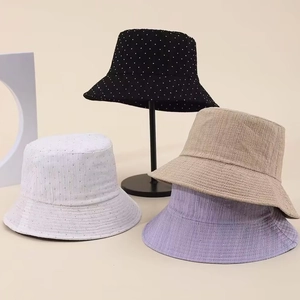 Detail showing various colors and textured fabric patterns of the bucket hats