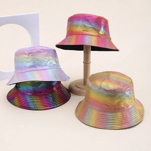 Iridescent PU bucket hats with metallic gradient finish displayed on wooden stands