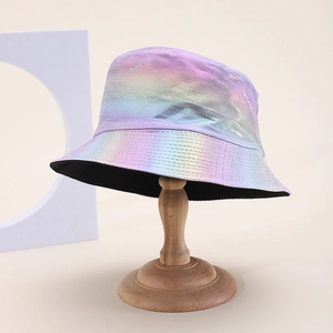 Iridescent metallic bucket hat with rainbow laser coating on a wooden display stand