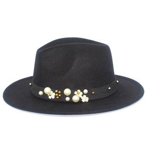 Detailed view of fedora hat with elegant pearl, gold bead and floral ribbon trim