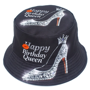 Detail of Happy Birthday Queen bucket hat with lipstick and high heel print motifs