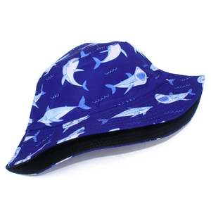 Detailed pattern of light blue sharks and waves on dark blue reversible bucket sun hat
