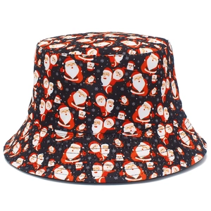 Detail shot of Christmas bucket hat featuring Santa Claus prints and snowflake patterns