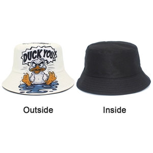 Detail of reversible bucket hat showing white side with angry duck print and black inner side