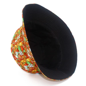 Close-up of Christmas bucket hat showing festive snowmen, reindeer and ginger man prints