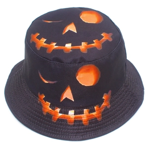Black cotton bucket hat featuring Halloween pumpkin face prints for sun protection