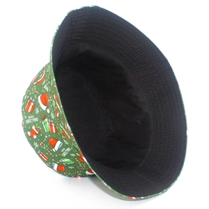 Detail of Christmas bucket hat showing Merry Christmas print and black inner lining