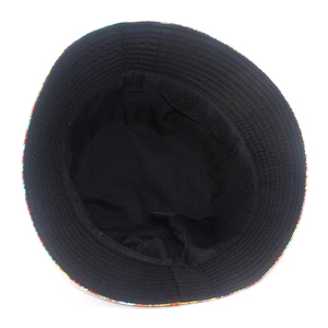Detailed view of the black inner lining and colorful Christmas pattern on a bucket hat