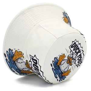 Detail of white bucket hat featuring a cartoon duck print and Duck You text embroidery