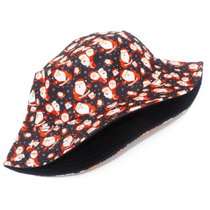 Detail of Christmas bucket hat featuring Santa Claus and snowflake prints on black fabric