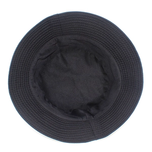 Detail view of the multi-row parallel stitching on a black cotton bucket hat brim