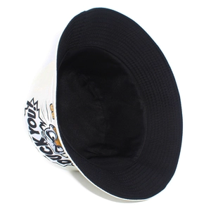 Detail of white cotton bucket hat featuring black street style graffiti and bold text