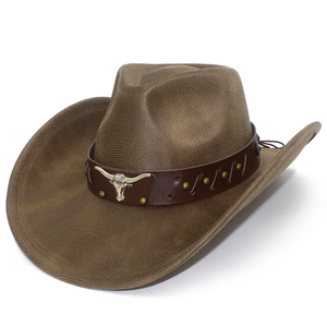 Detail of brown faux leather cowboy hat featuring bull head metal ornament and studs