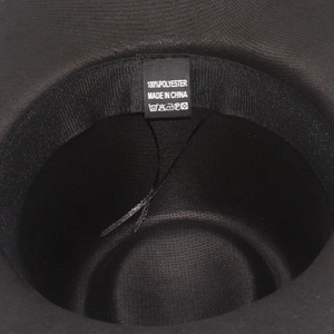 Detail shot of the 100% polyester inner sweatband and product labels inside the hat
