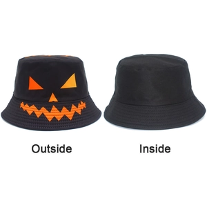 Detail showing the reversible design of the black pumpkin bucket hat, inside and outside