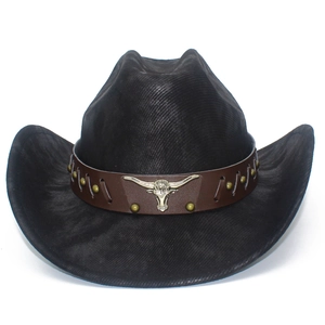 Detailed view of the dark brown leather belt and silver bull head ornament on the cowboy hat