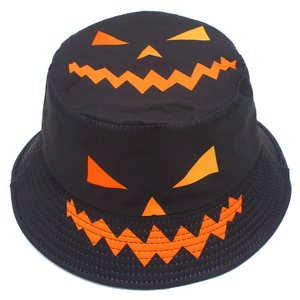 Close-up of black cotton bucket hat with orange Halloween Jack-o'-lantern face patterns