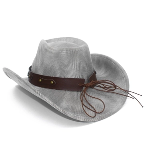 Detail of grey woven cowboy hat with brown leather band and metal rivets on white background