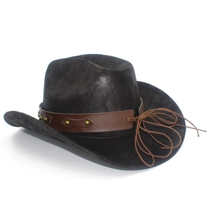 Close-up of black western cowboy hat featuring brown leather band and metal rivets