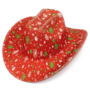 Detail of red Christmas cowboy hat featuring sparkling snowflake patterns and woven texture