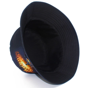 Detail of black canvas bucket hat featuring orange Happy Halloween pumpkin print