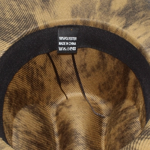 Detail view of the interior lining and care label of the vintage style polyester jazz hat
