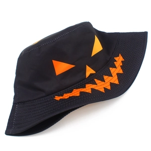 Close-up of Halloween bucket hat with orange jack-o-lantern face and stitched brim