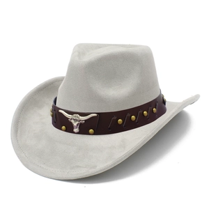Detail of grey felt cowboy hat featuring brown leather band and silver bull head ornament