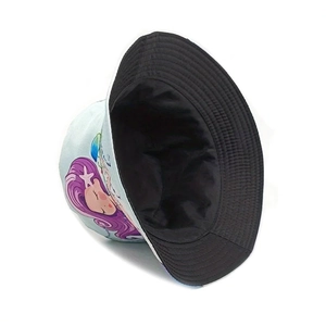 Detailed view of bucket hat featuring mermaid pattern and contrast black interior lining