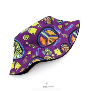 Deep purple bucket hat with colorful graffiti prints and peace signs on white background