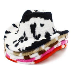 Detail shot of plush cow print cowboy hats in black, brown, pink, and orange colorways