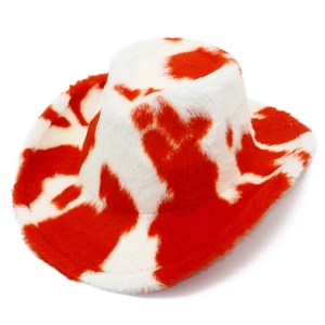 Close-up of fluffy red and white cow print texture on a warm western cowboy hat