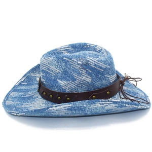 Detail of blue cowboy hat featuring silver sequins and a brown studded faux leather band
