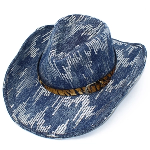 Close-up of blue sequin cowboy hat with tiger print band and metallic buckle detail