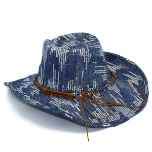 Detail of dark blue denim cowboy hat with silver sequins and brown tassel strap