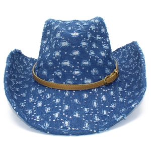 Close-up of blue denim cowboy hat with silver sequins and distressed details