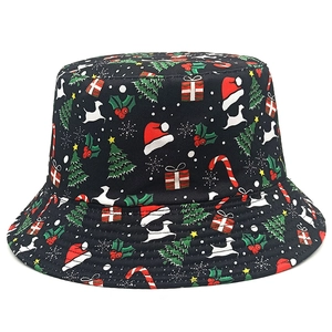 Detailed view of Christmas bucket hat with festive reindeer and snowflake patterns