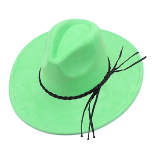 Detailed macro view of the bright green suede jazz hat with a black tassel leather band