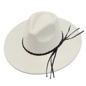 Detail of cream white wool fedora with woven black band and long stylish tassel