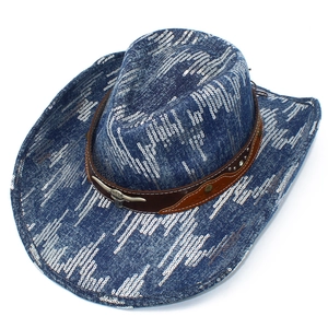 Detail of blue sequined cowboy hat featuring brown leather belt with metal bull head buckle