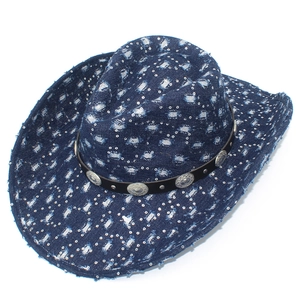 Detail of blue denim cowboy hat with silver studs and embossed leather band accents