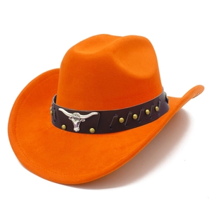 Detail of orange suede jazz hat with brown leather band and silver bull head emblem