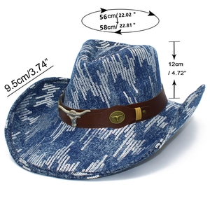 Detailed view of denim cowboy hat with bull head emblem and brown leather strap