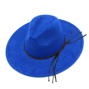 Close-up of royal blue fedora hat with wide brim and black braided band decoration