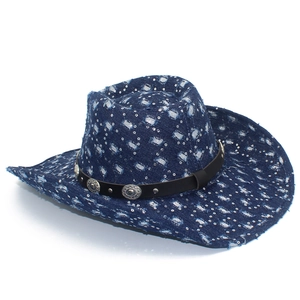 Close-up of distressed blue denim cowboy hat with silver sequins and metallic buckles