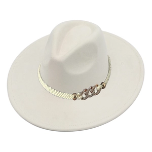 Detail of suede fedora with wide brim and woven band featuring gold chain link accent