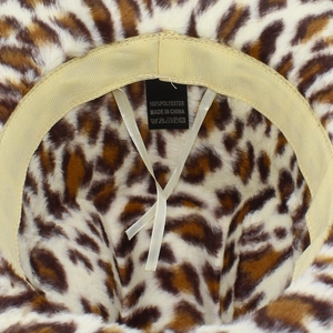 Detail view showing the 100% polyester label and adjustable inner ribbon of the hat