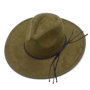 Detail of olive green suede fedora featuring a black braided leather band and tassel accents
