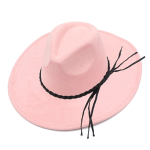 Detail of pink faux suede fedora hat with black braided band and long hanging tassels