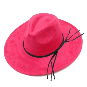 Detail of rose red suede fedora showing the black woven band and long fringe tassels